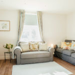 Living area of 1 The Elms with two comfortable sofas
