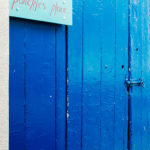 Blue door off Back Road East to enter Ponckle's Place