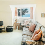 Living area in Mylor with sea views