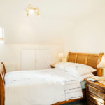 Master bedroom with double bed in Mylor