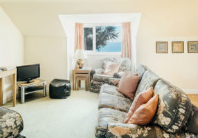 Living area in Mylor with sea views